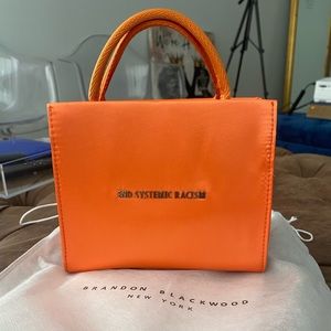 Brandon Blackwood ESR Orange Satin Purse